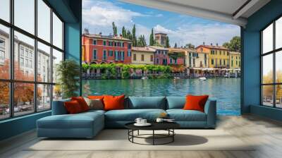 Peschiera del Garda, a picturesque village adorned with colorful houses, nestled along the stunning shores of Lake Lago di Garda in the Verona province of Italy Wall mural