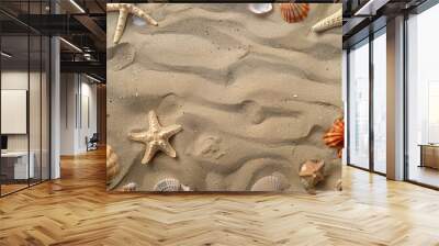 Sandy beach with seashells and starfish scattered around, creating a natural and textured background Wall mural