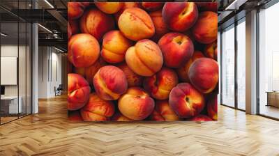 Top view of a background filled with fresh ripe peaches, showcasing their vibrant orange color and juicy texture Wall mural