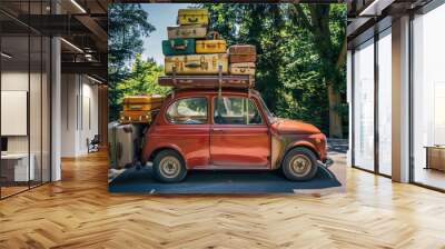 A red car is loaded with luggage and it is a vintage car. The scene gives off a sense of adventure and travel Wall mural