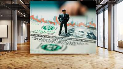 A man stands on top of a stack of one hundred dollar bills Wall mural