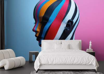 A woman's face is painted with a rainbow of colors Wall mural