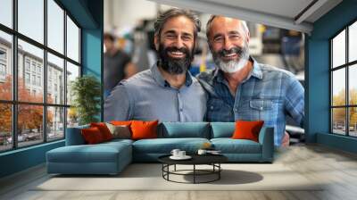 Two men with beards are smiling and posing for a picture Wall mural