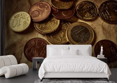 Vintage background with different euro coins on aged paper Wall mural