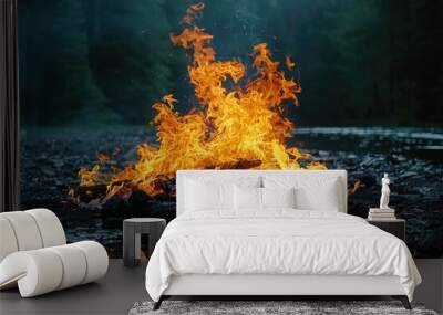 A Fiery Bonfire Reflecting in a Still Body of Water Wall mural