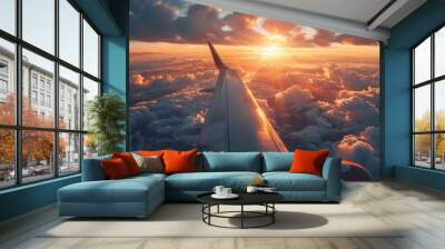 Airplane Wing Above Clouds with Sunset Glow Wall mural