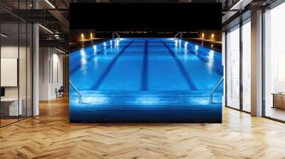 Illuminated Swimming Pool at Night with City Lights in the Distance Wall mural