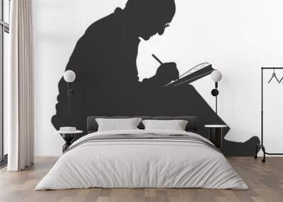 Silhouette of a person writing in a notebook Wall mural