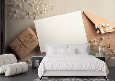 Invitation or greeting card mockup with gift box and gypsophila plant twigs Wall mural