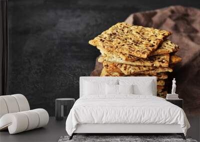 Multigrain crunchy crispbread on a dark concrete background. Wall mural