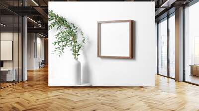 Square frame mockup in white room interior with fresh eucalyptus plant in vase Wall mural