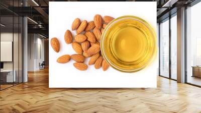 Almond oil and almonds nuts isolated on white background. Top view. Flat lay. Wall mural