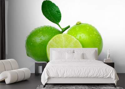 Closeup two whole fresh organic lime fruit with green leaf ,water droplets  and cut in half slice isolated on white background.  Wall mural