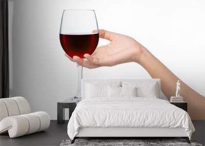 glass of red wine in hand isolated on white Wall mural