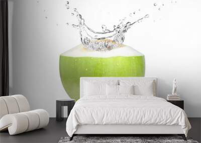 Green coconut with coco nut water splash isolated on white background. Wall mural