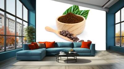 Roasted coffee beans in scoop and coffe powder (ground coffe) in wooden bowl with green leaf isolated on white background.  Wall mural