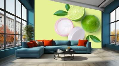 Skin care cream cosmetics in jar with lime on green texture background Wall mural