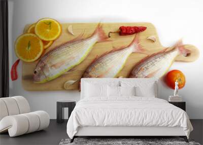 Fresh Pink Perch fish with ingredients like lemon,curry leaves,chilli,selective focus.white background. Wall mural