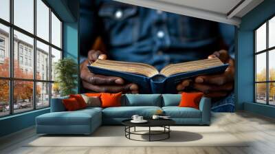 Manâ€™s hands, holding a meeting agenda, close-up, soft focus background Wall mural