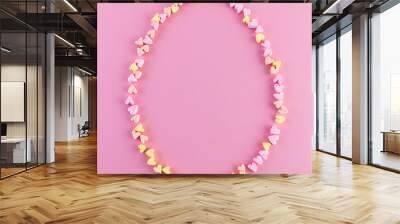 Easter egg made of marshmallows in the shape of hearts, contour. Copy space, pink background, square orientation Wall mural