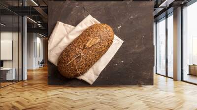 Bread and flour on a dark table Wall mural