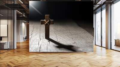 Wooden cross on dark background with copy space. Wall mural