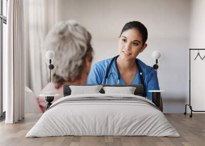 Support, healthcare and nurse with a senior patient explaining a diagnosis after consultation. Medical, empathy and female caretaker volunteer consoling an elderly lady in retirement at nursing home. Wall mural