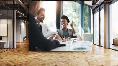 The only way were going is up. Cropped shot of businesspeople working together in the office. Wall mural