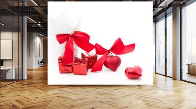  gifts in a white basket with a heart with a bow in red on a white background Wall mural