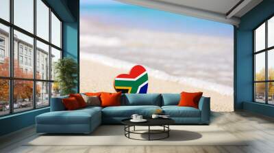 Flag of South Africa in the shape of a heart on a sandy beach. The concept of the best vacation in South Africa. Wall mural