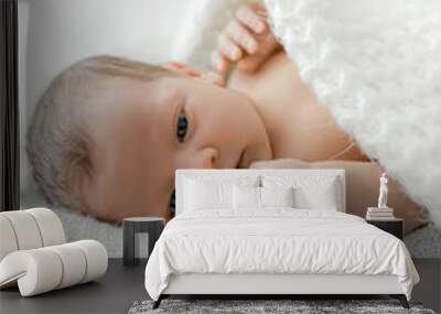 portrait of a newborn on white plaid. Wall mural