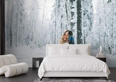 Russian beautiful girl in winter forest Wall mural