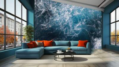 Stormy ocean waves with white foam aerial view hitting rocks in Hawaii Wall mural