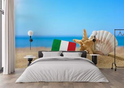 tropical beach with seashells and italy flag. the concept of a paradise vacation on the beaches of i Wall mural