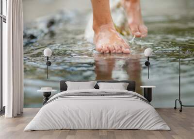 Girls legs on the water Wall mural