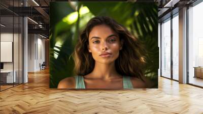 Beautiful Young Woman With Perfect Skin and Natural Makeup on Background of Tropical Leaves Wall mural