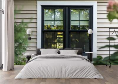 Black Single Hung Window With White Frame in a House With Vinyl Siding Wall mural