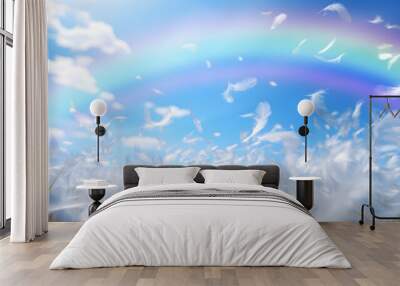 Beautiful rainbow arcing across summer's day blue sky -  large transparent rainbow against a blue sky and fluffy white feathers floating in the sky and below with space for a spiritual message
 Wall mural