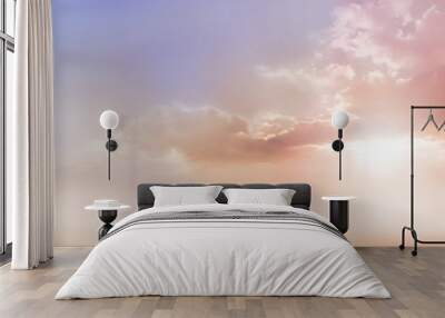 Dreamy Romantic Sky scape - beautiful wide peach and dusky pale blue sky and cloud scape with a burst of sunlight emerging from under the cloud base with plenty of copy space Wall mural