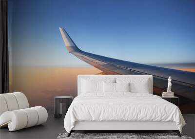 airplane wing against sunset sky background Wall mural