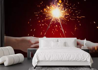 sparklers in hands Wall mural