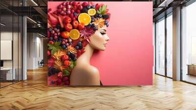 Portrait of a girl whose hair is covered with fruits and leaves. Wall mural