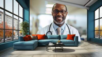 Portrait of a smiling middle aged male doctor in hospital Wall mural