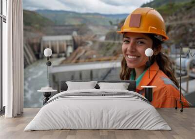 Portrait of a smiling young hispanic male engineer at hydroelectric plant Wall mural