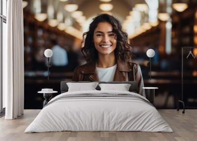 Portrait of a young female student in a library Wall mural