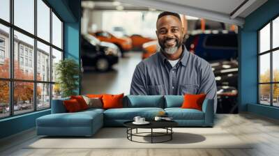 Smiling portrait of a middle aged car mechanic Wall mural