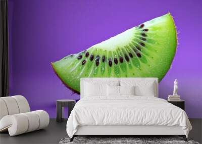 Vibrant kiwi slice on a purple background Wall mural