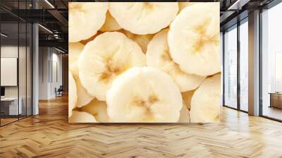 Background of ripe sliced yellow healthy banana slices, closeup. Food organic natural backdrop from fruit Wall mural