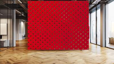 Dark red background from metal foil paper with a golden stars pattern. Wall mural