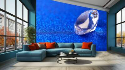 Grand royal pure diamond on blue sparkling sequins background, macro . Big brilliant closeup Wall mural